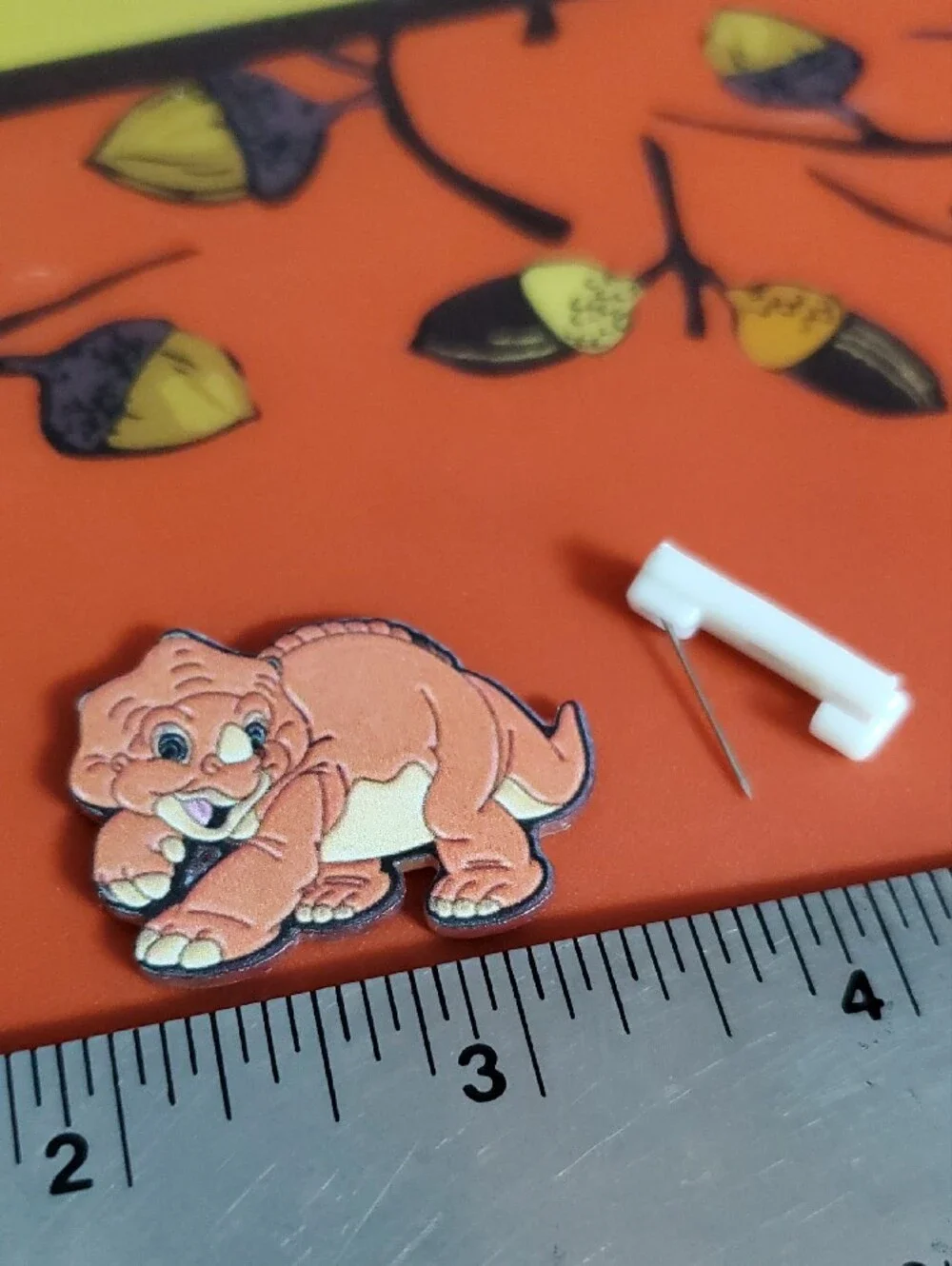 Cute Cartoon Baby Dinosaur Acrylic Pin - Orange & Cream